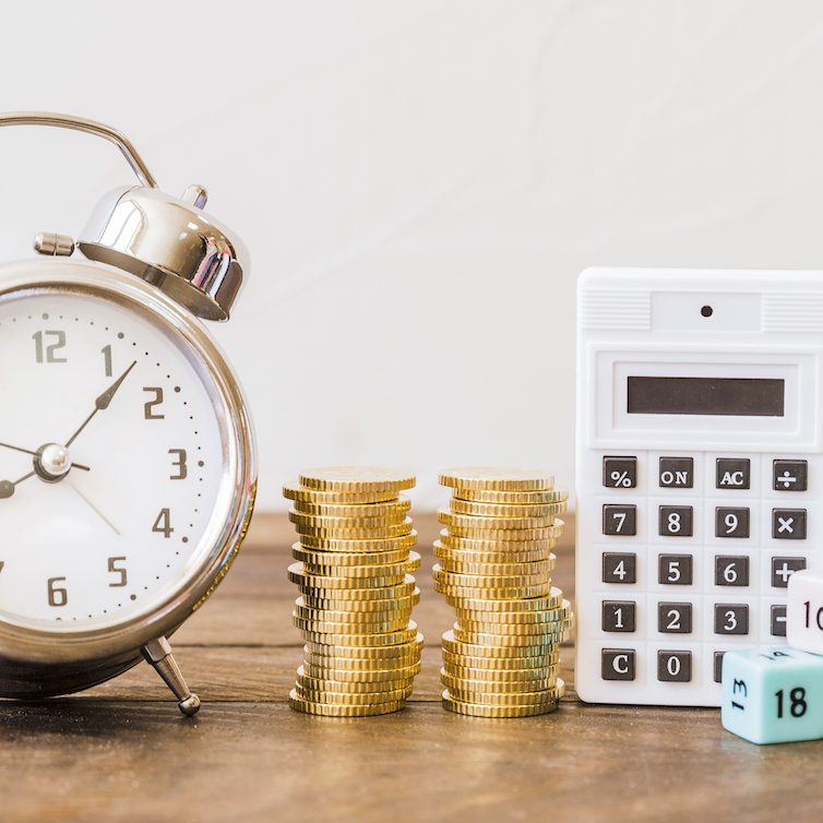 Clock coins calculator dice on table