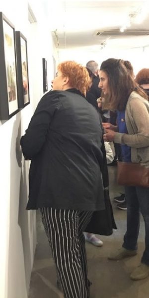 Women looking at art - profile