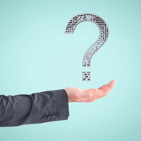 composite of hand holding questionmark graphic with blue background
