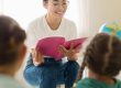 front-view-woman-reading-something-her-students