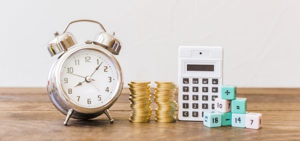 Clock coins calculator dice on table