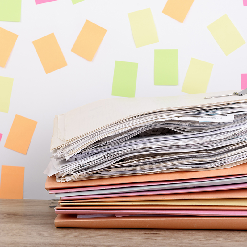 Stacked documents on the office desk,Colorful paper post it the Stacked documents on the office desk,Colorful paper post it the background