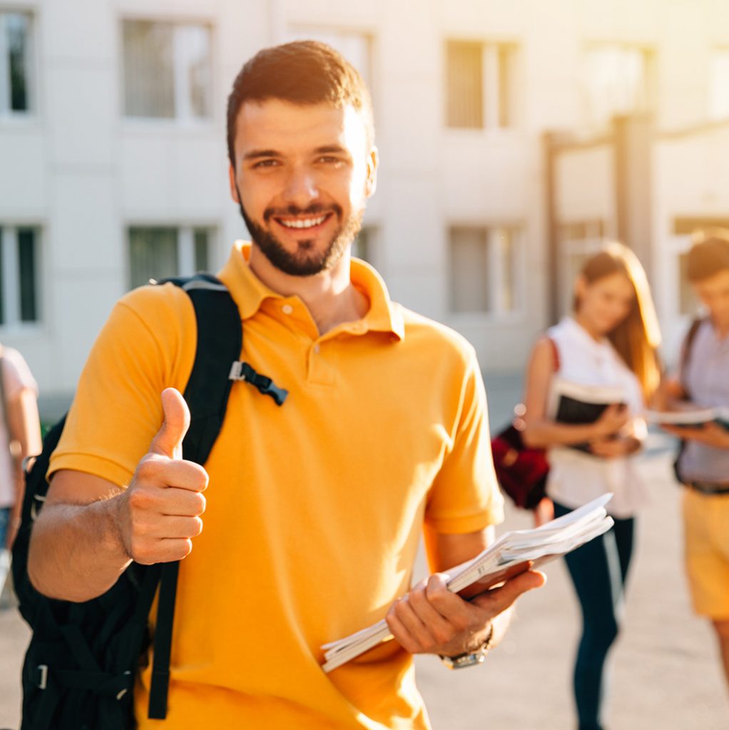 Young student giving the thumbs up