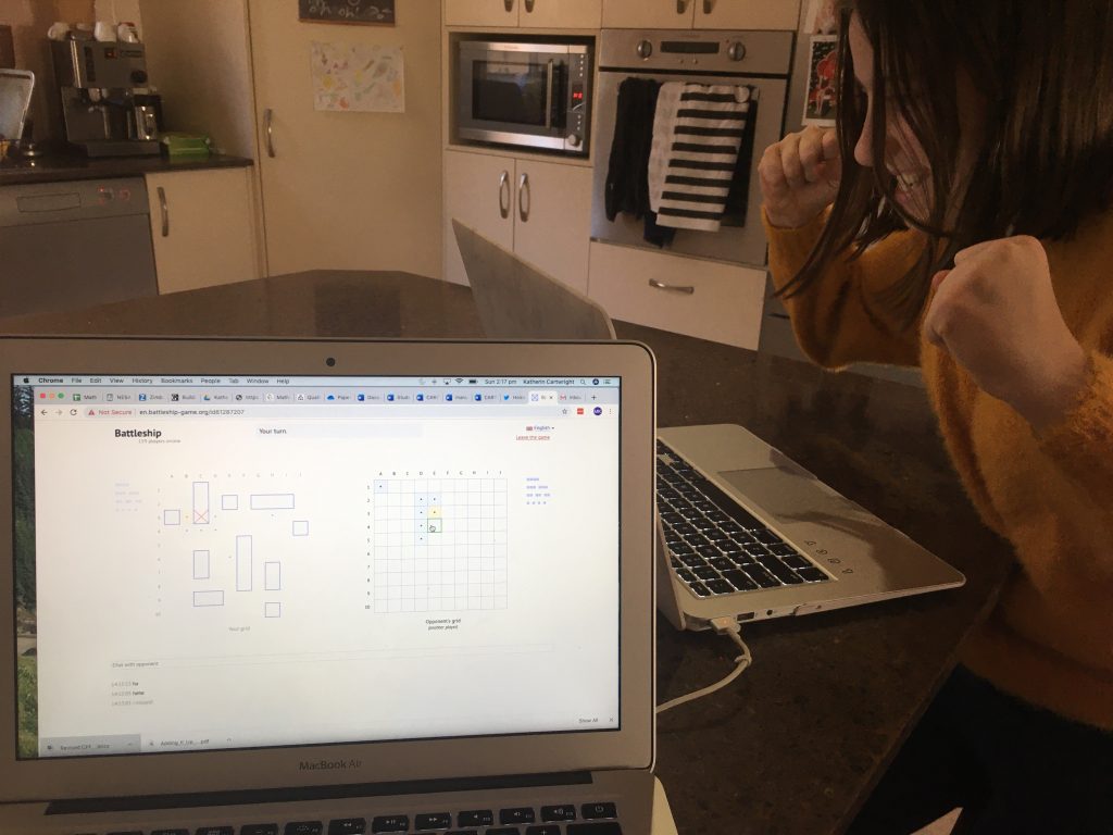 online learning image 5 image of child playing battleships on computer