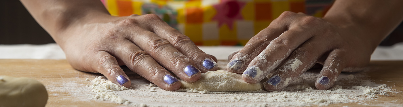 Women's hands make dough for Azerbaijani dish gutab.