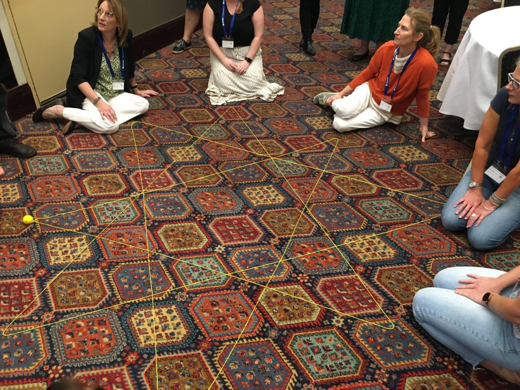 image-2-mansw teachers making a star with wool