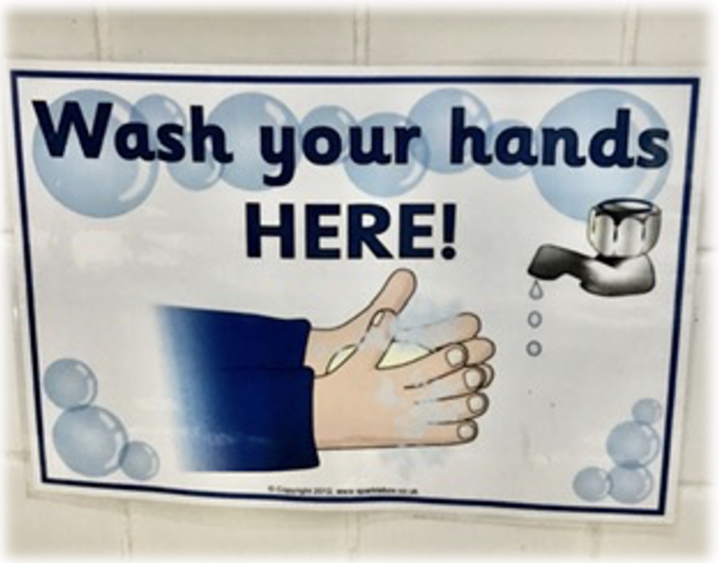 Wash your hands here sign