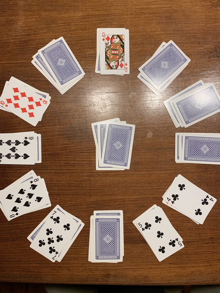 image-three-games mid-way through a game of clock patience