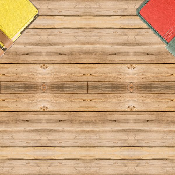 top view of old book stack over wooden table. filtered image