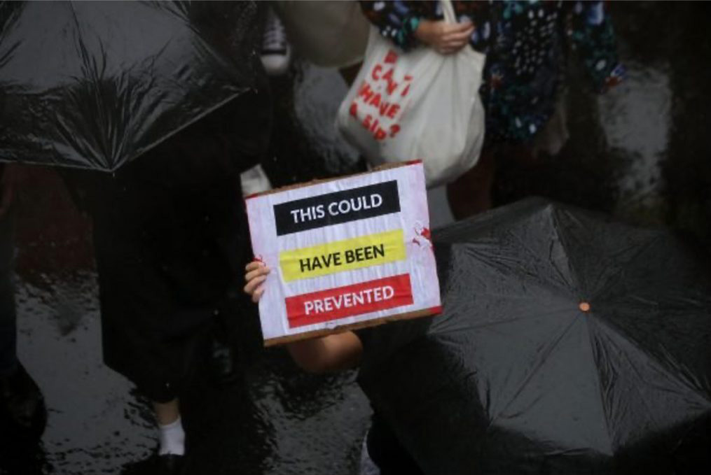Protestor-holding-a-this-could-have-been-prevented-sign Protestor holding a this could have been prevented sign