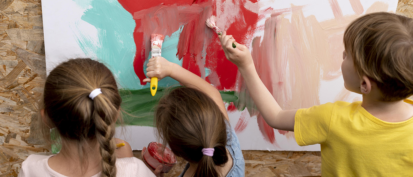 close-up-of-kids-painting-together