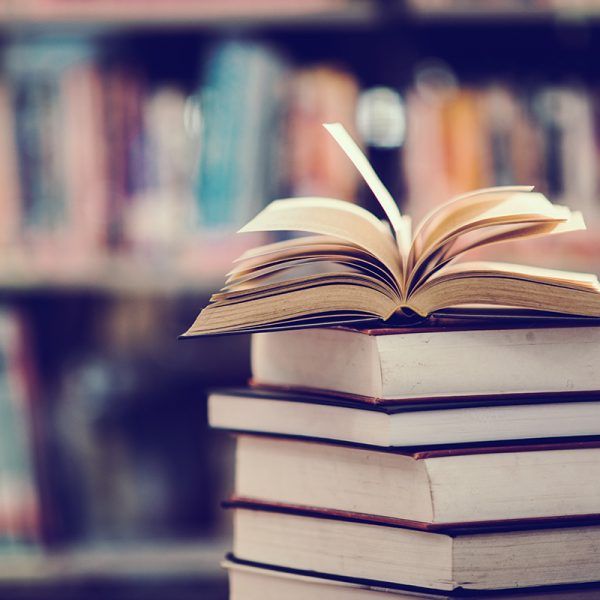 Book in library with open textbook,education learning concept Book in library with open textbook,education learning concept