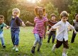 Group of Diverse Kids Playing at the Field Together