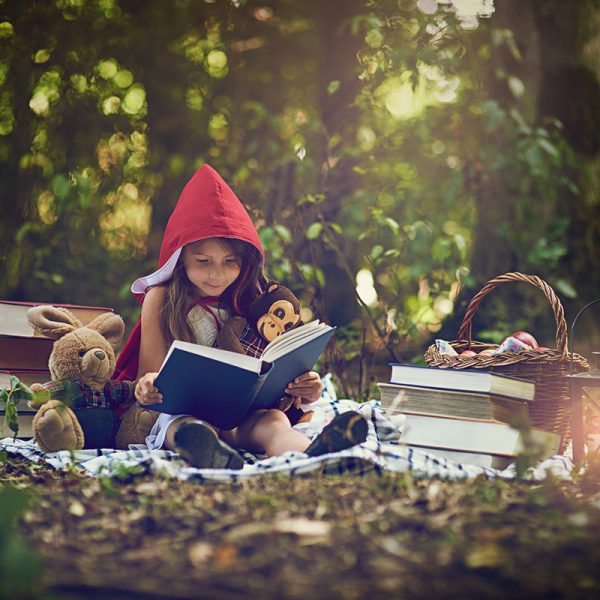 Books can transport us to the most magical places. Shot of a lit